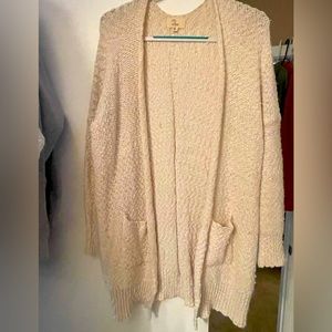Warm, cozy wrap around sweater with pockets.
